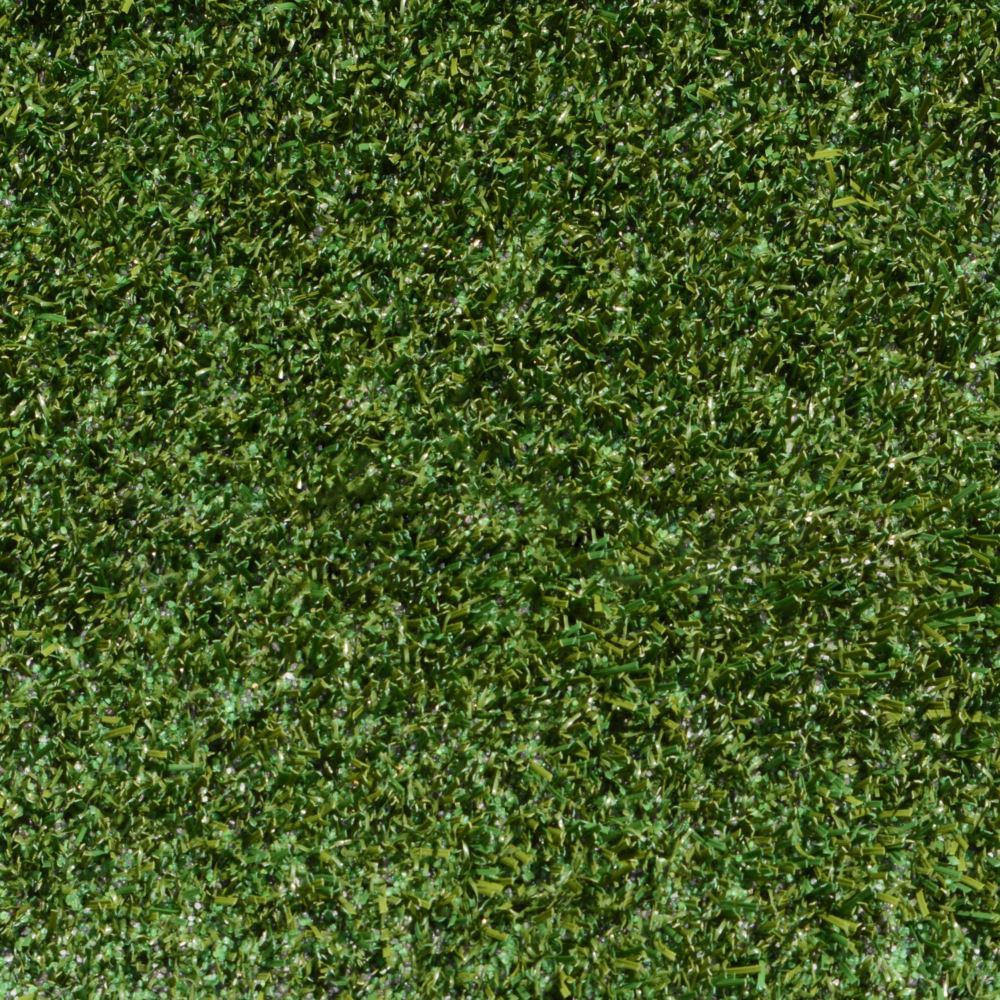 Close up shot of artificial pet turf with green and brown strands Close up shot of artificial pet turf with green and brown strands